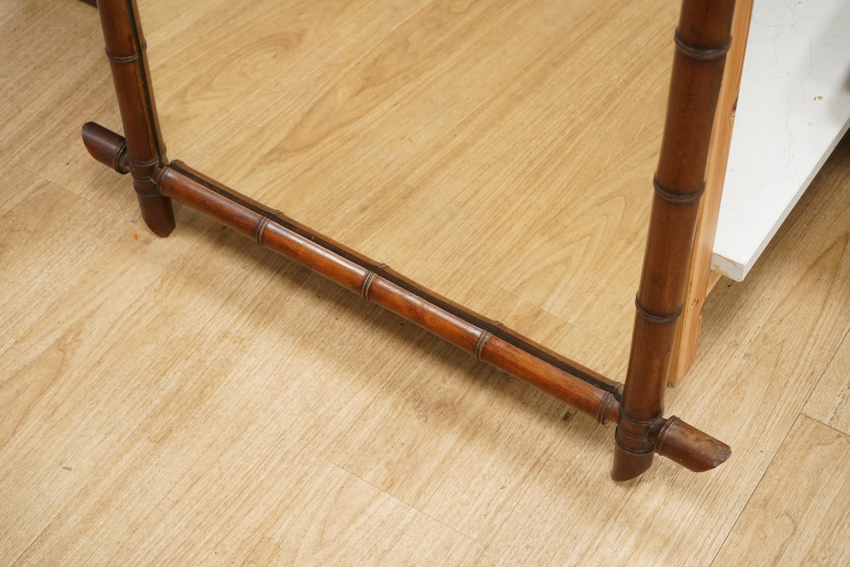 A large late 19th century faux bamboo mirror, 104cm high